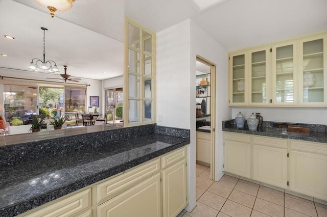 kitchen featuring ceiling fan, pendant lighting, light tile patterned floors, and cream cabinets