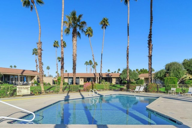 view of swimming pool featuring a patio area