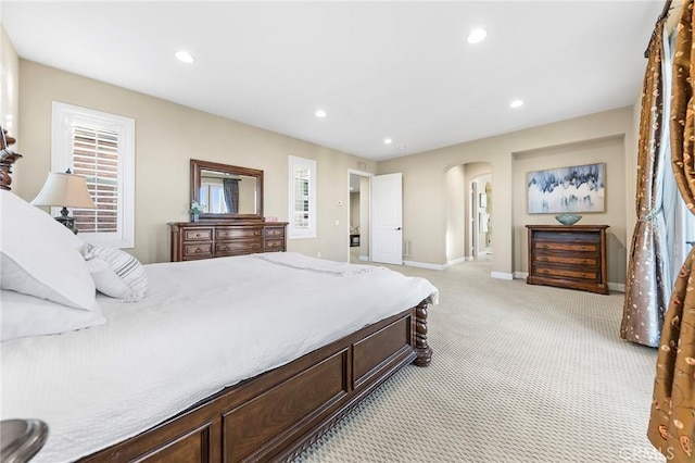 bedroom featuring light colored carpet