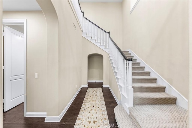 stairway with hardwood / wood-style floors