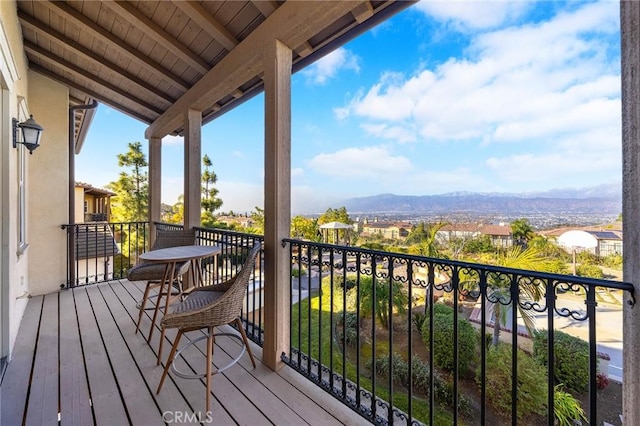 wooden terrace featuring a mountain view