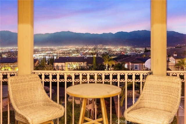 balcony at dusk with a mountain view