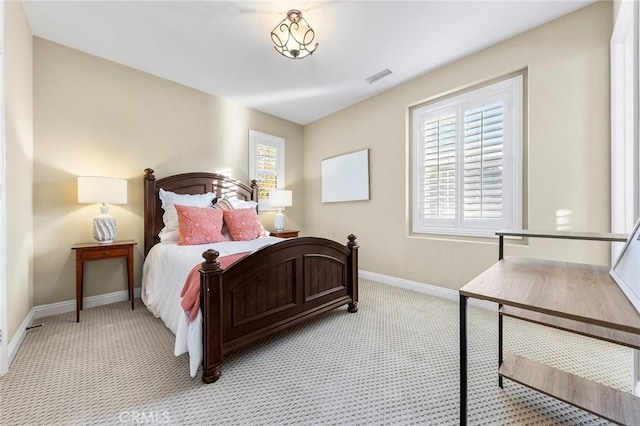 bedroom with light colored carpet