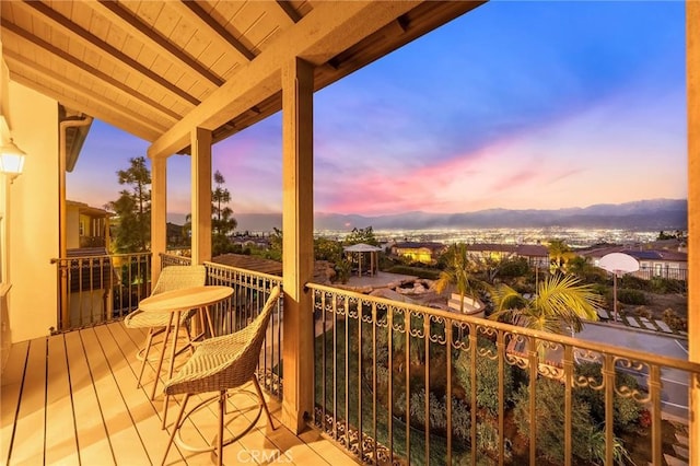 view of balcony at dusk