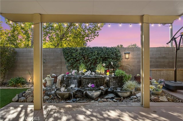 view of patio terrace at dusk