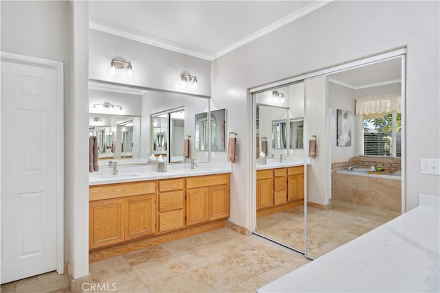 bathroom with tiled tub, crown molding, and vanity