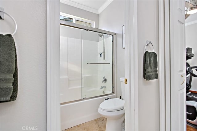 bathroom featuring toilet, enclosed tub / shower combo, and crown molding