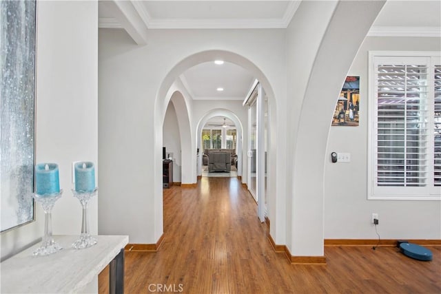 corridor featuring ornamental molding and hardwood / wood-style floors