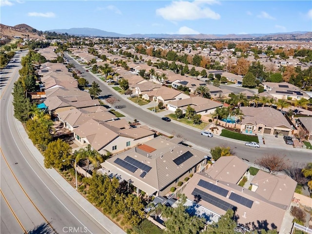 birds eye view of property with a mountain view