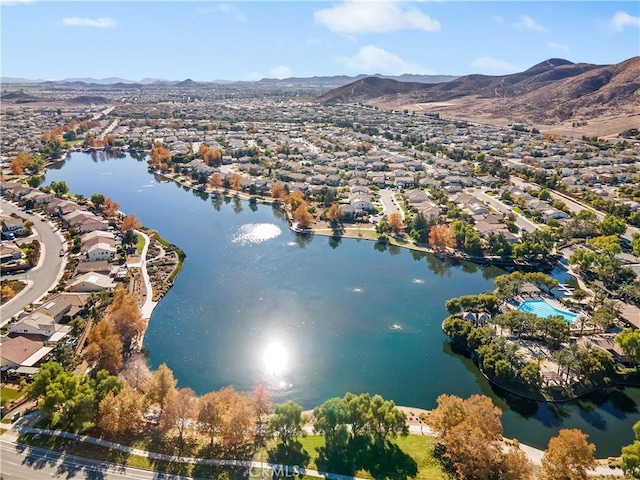 drone / aerial view featuring a water and mountain view