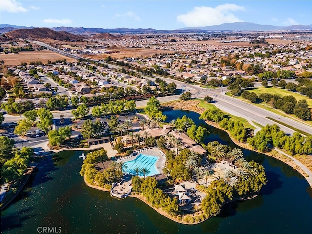 drone / aerial view with a water and mountain view