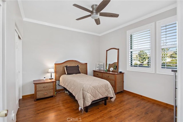 bedroom with ceiling fan, crown molding, and dark hardwood / wood-style floors