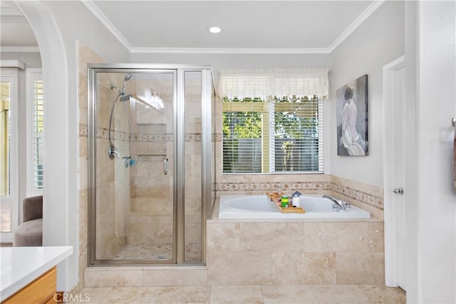 bathroom with ornamental molding, independent shower and bath, tile patterned flooring, and vanity