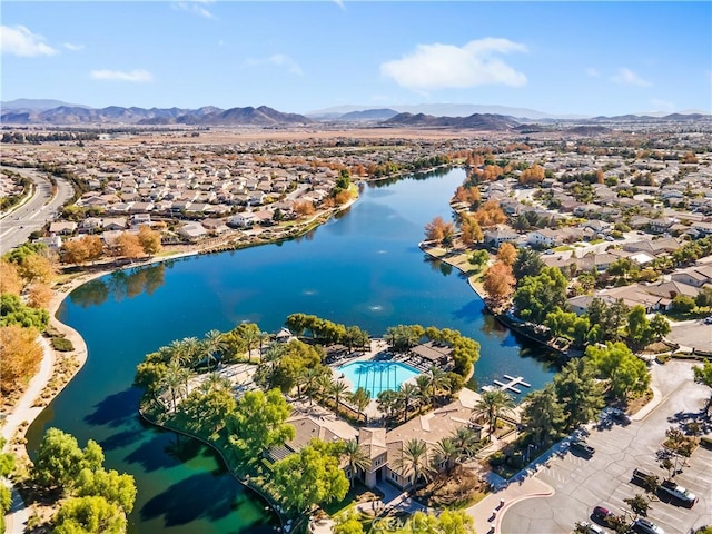 birds eye view of property featuring a water and mountain view