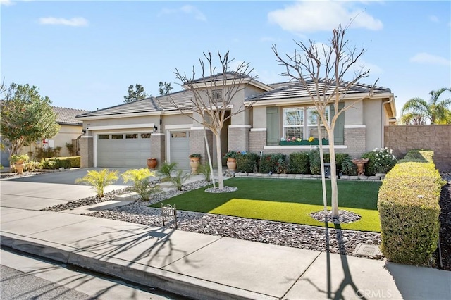 view of front facade featuring a front lawn and a garage