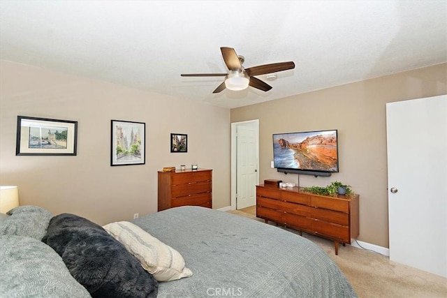 bedroom with light carpet and ceiling fan