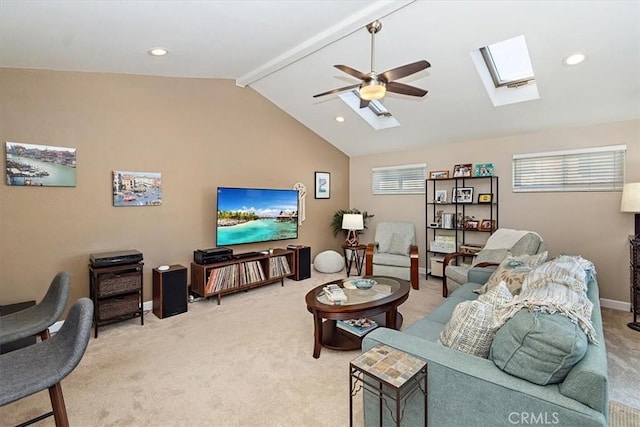 carpeted living room featuring lofted ceiling with beams and ceiling fan