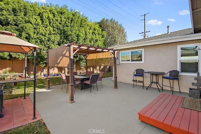 view of patio with a gazebo and a pergola