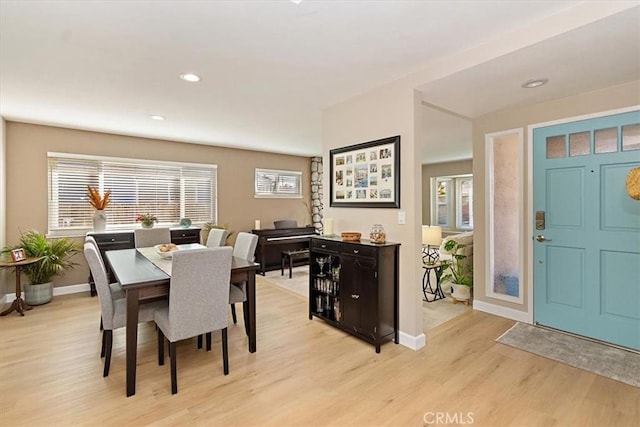 dining area with light wood-type flooring