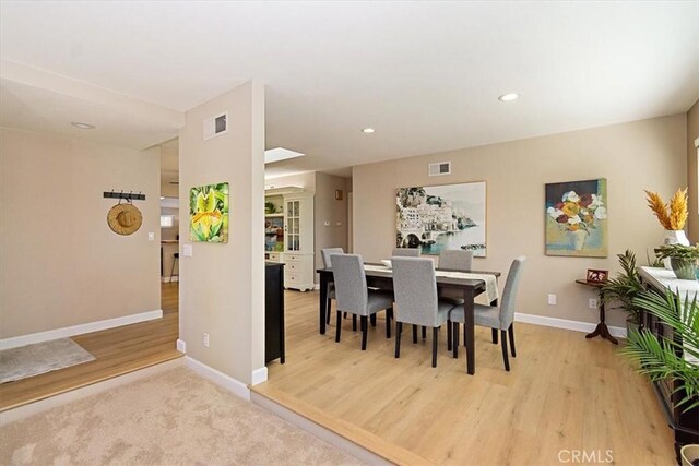 dining space featuring light hardwood / wood-style floors