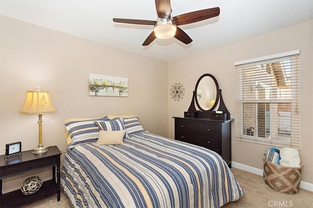 bedroom with light colored carpet and ceiling fan