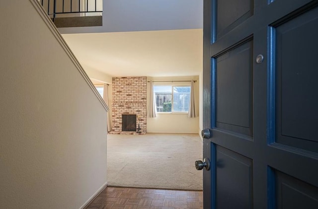 interior space with parquet flooring and a fireplace