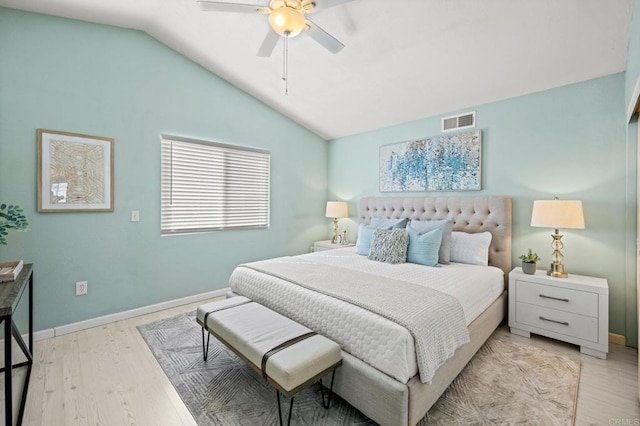 bedroom with vaulted ceiling, ceiling fan, and light hardwood / wood-style flooring