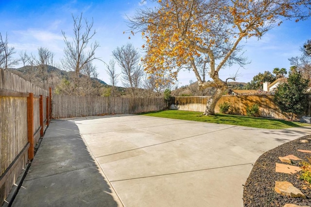 view of patio / terrace featuring a mountain view