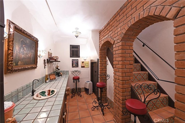 interior space with stairs and arched walkways