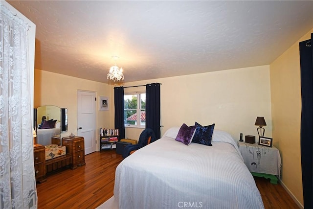 bedroom with dark hardwood / wood-style flooring