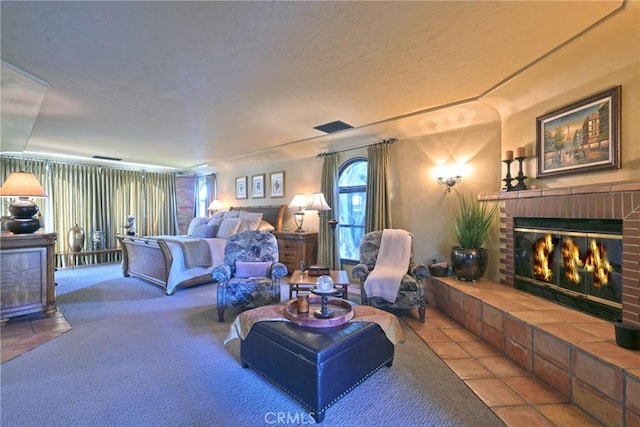 carpeted bedroom featuring a brick fireplace