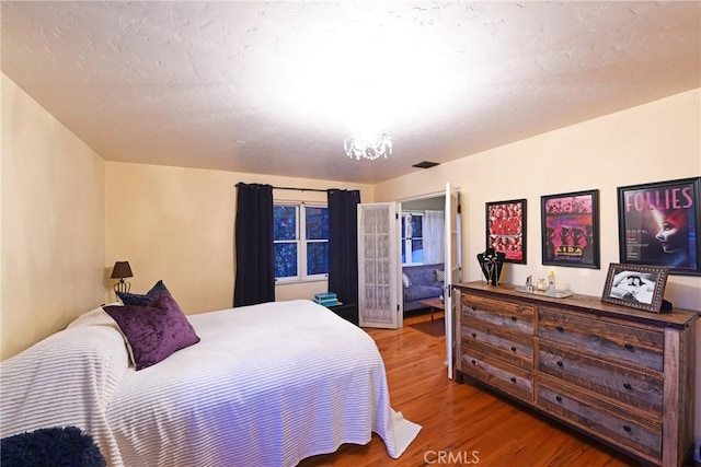 bedroom featuring wood finished floors