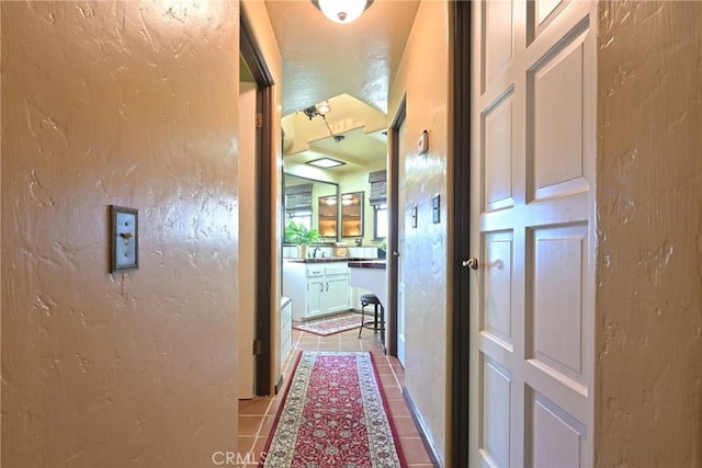 corridor featuring tile patterned floors