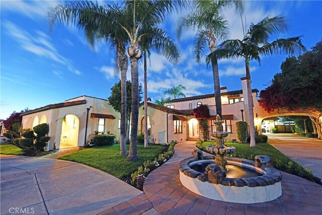503 W Madison Ave, Placentia, CA 92870 - mediterranean / spanish-style house with stucco siding and curved driveway