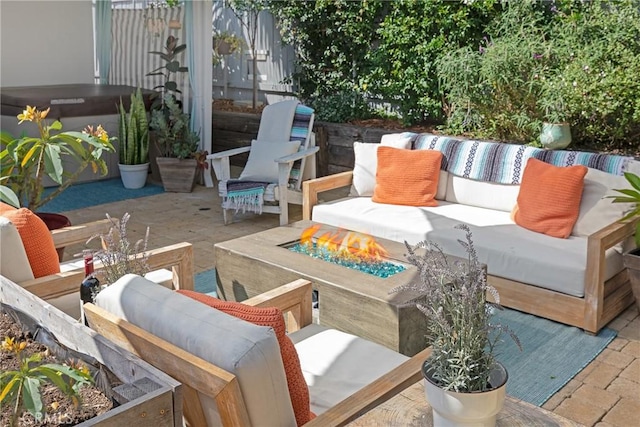 view of patio / terrace featuring an outdoor living space with a fire pit