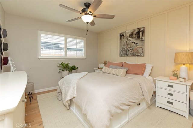 bedroom featuring ceiling fan and light hardwood / wood-style flooring