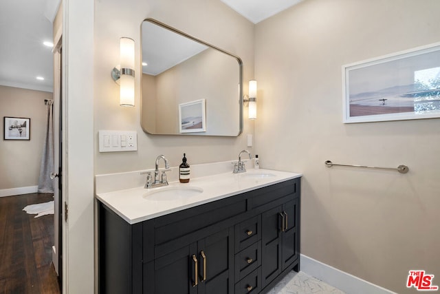 bathroom featuring vanity and hardwood / wood-style floors