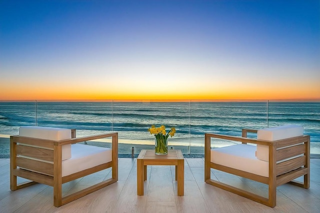 balcony at dusk with a water view