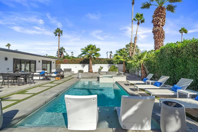 view of swimming pool with a patio