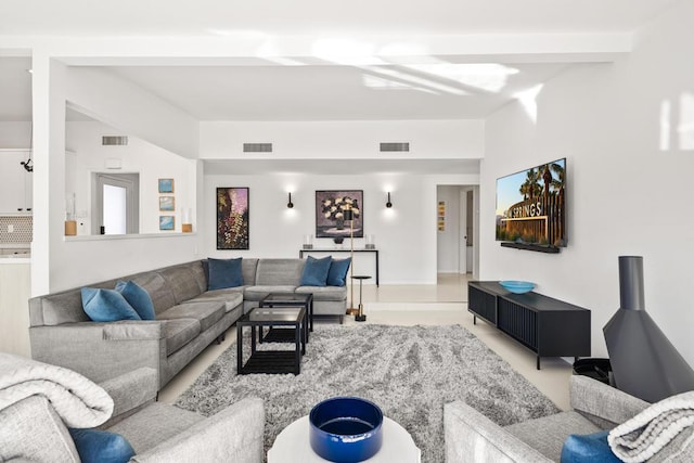 living room featuring beam ceiling