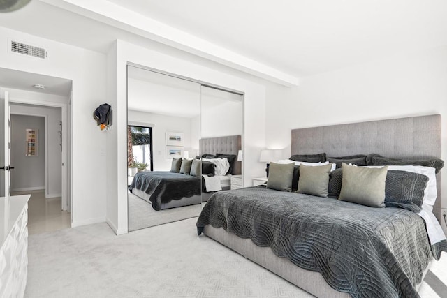 carpeted bedroom with a closet