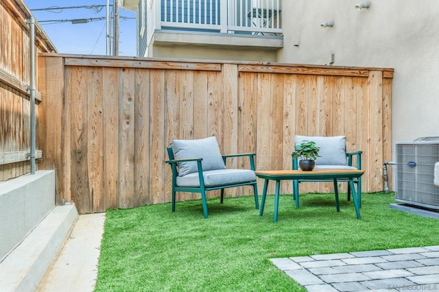 exterior space with a balcony and central air condition unit