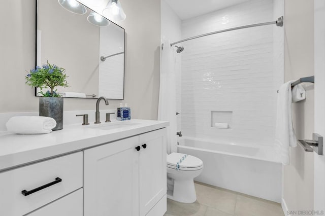 full bathroom featuring toilet, vanity, tile patterned flooring, and shower / tub combo with curtain