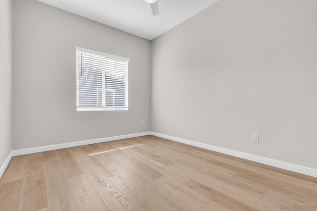 spare room featuring ceiling fan and light hardwood / wood-style flooring