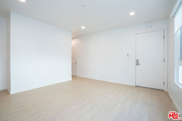 unfurnished room featuring light wood-type flooring