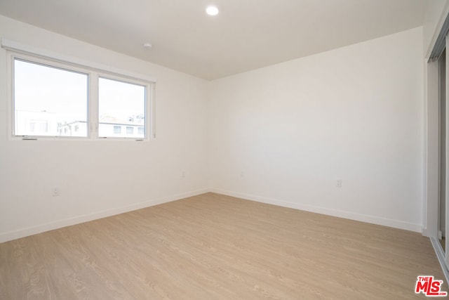 empty room with light wood-type flooring