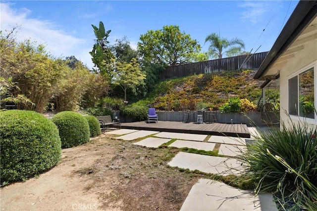 view of yard featuring a wooden deck