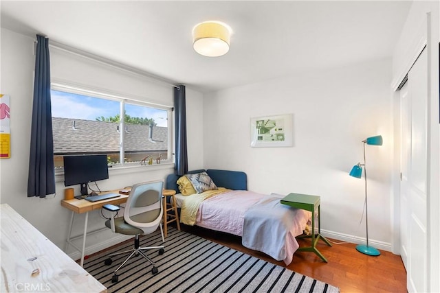 bedroom with hardwood / wood-style floors