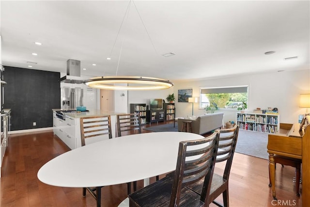 dining area featuring wood-type flooring