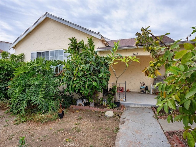 view of side of home with a patio area